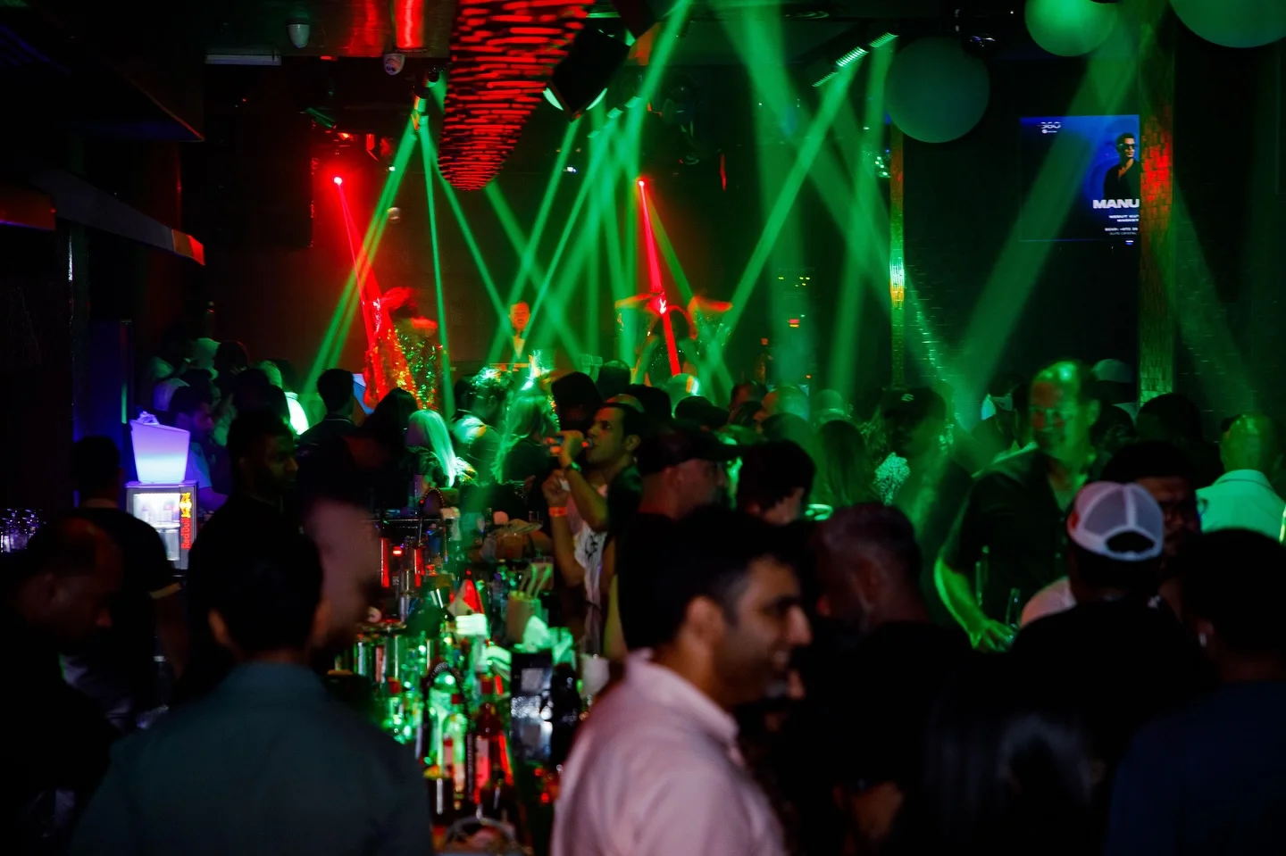 Crowd under red lights